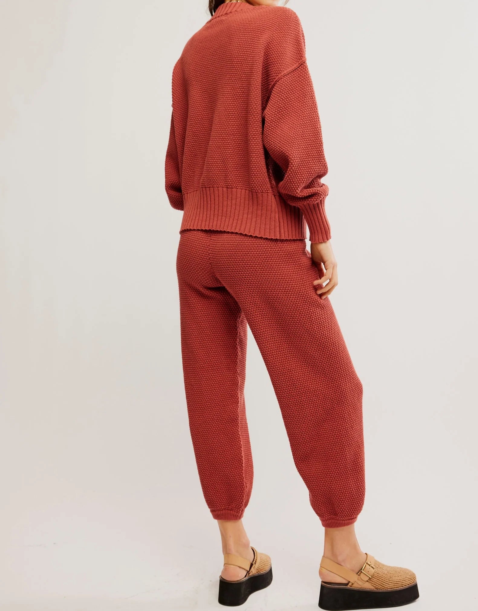 Free People Hailee Cardi Set featuring a soft, knit fabric with a relaxed fit. The set includes a long-sleeve, open-front cardigan and matching knit pants, offering a cozy and stylish look, perfect for casual wear or lounging, Canyon Sunset