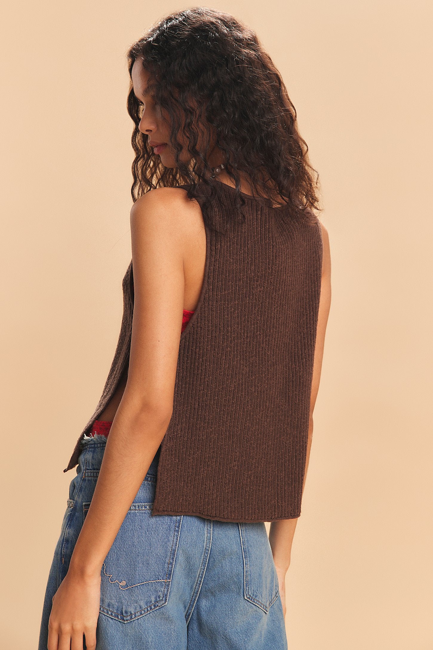 Free-est Lizzie Sweater Top — a relaxed, cropped knit top featuring a scoop neckline, ribbed texture, dropped armholes, and side tie closures for an airy, laid-back silhouette with a touch of playful detail, Carafe