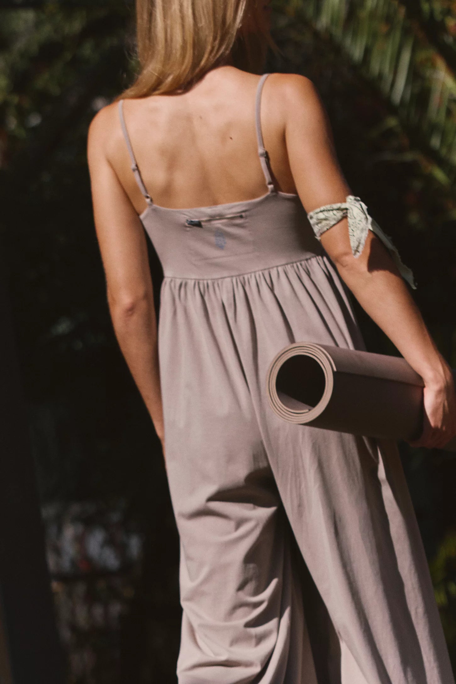 Free People Hot Shot Strappy Onesie, featuring soft cotton-blend fabric, simple shoulder straps, empire waist, and wide-leg slouchy fit, Hickory