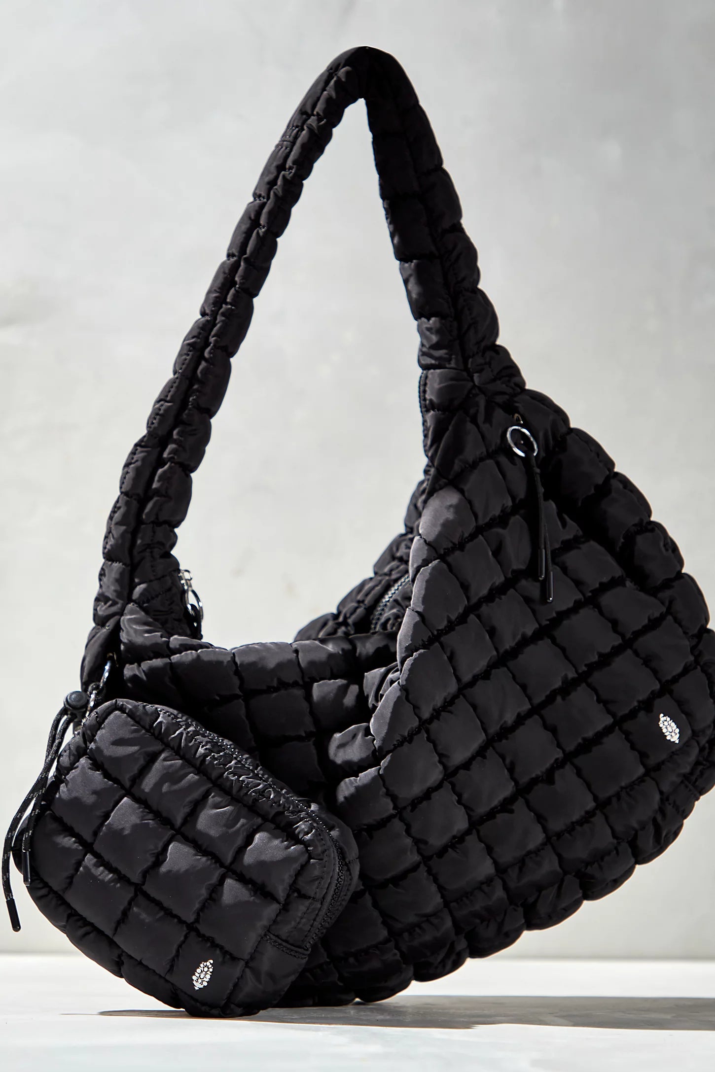 Free People Movement quilted carryall bag, oversized tote with padded texture, spacious interior, and casual sporty style, Black
