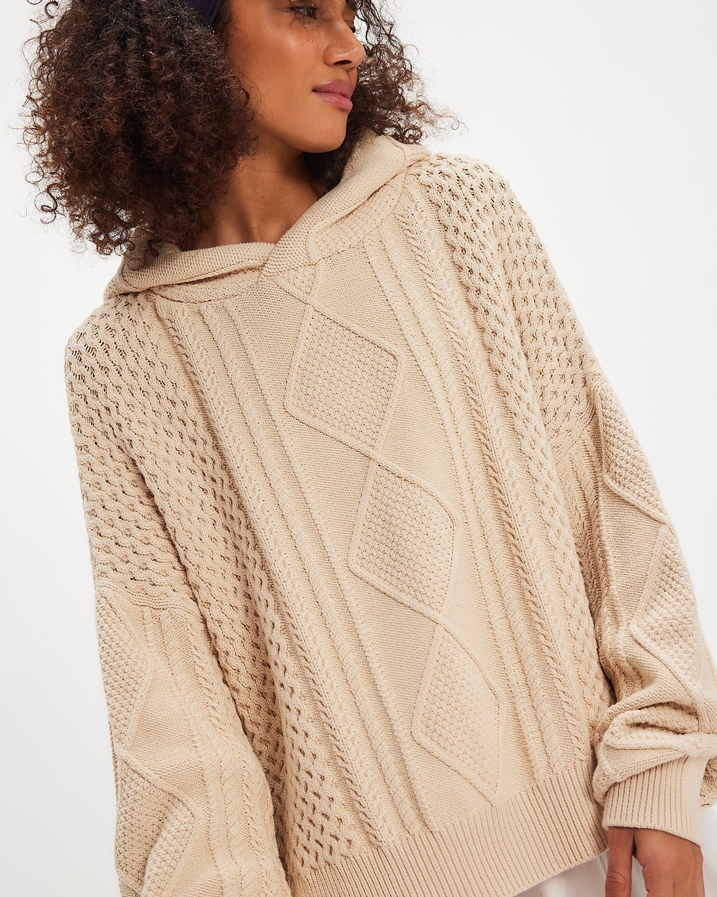 Free People Explorer Cable Hoodie featuring chunky cable knit texture, slouchy oversized fit, and cozy hood, Macadamia