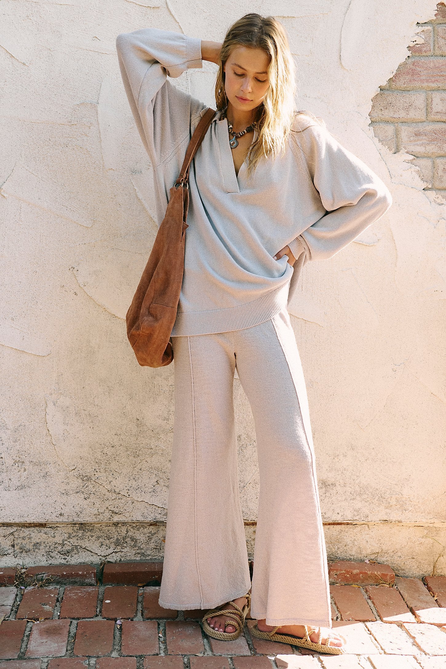 Free People Drea Sweater Set in a cozy knit fabric, featuring a relaxed-fit long-sleeve sweater and matching wide-leg pants, styled for a casual, comfortable look, Quiet Grey