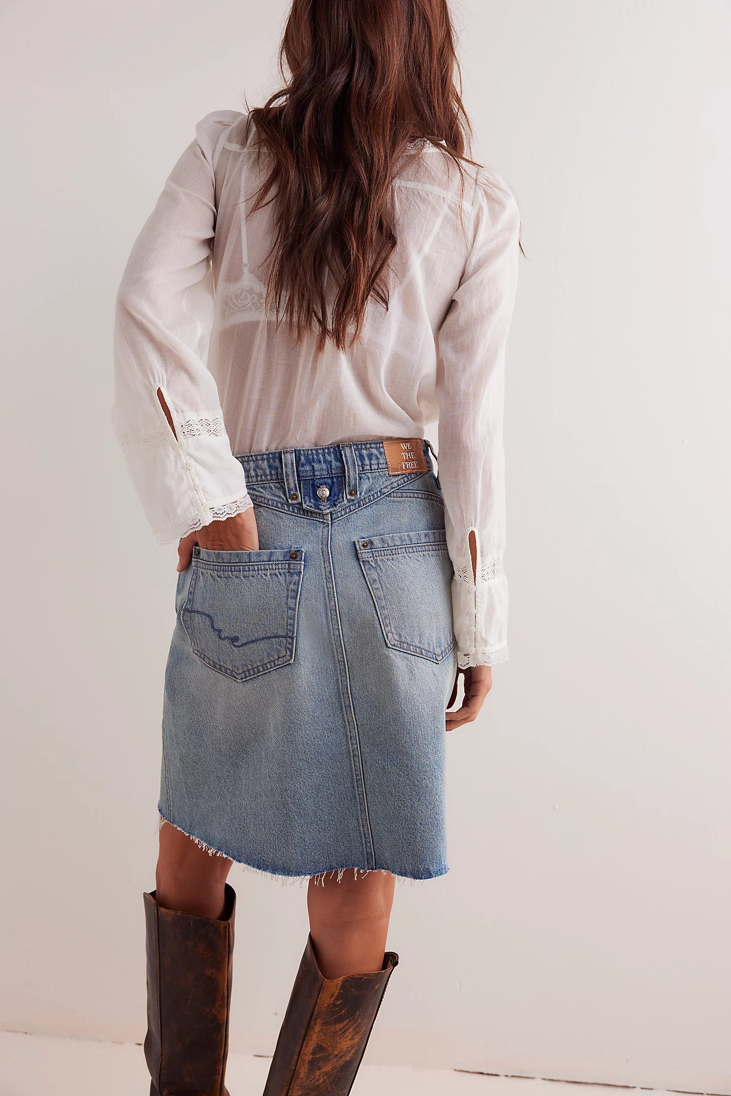 We The Free Denim Mini Skirt – a relaxed column-fit skirt with a zip fly, button closure, four-pocket styling, western-inspired yoke detailing, and frayed hemline, Sun Stoned Blue