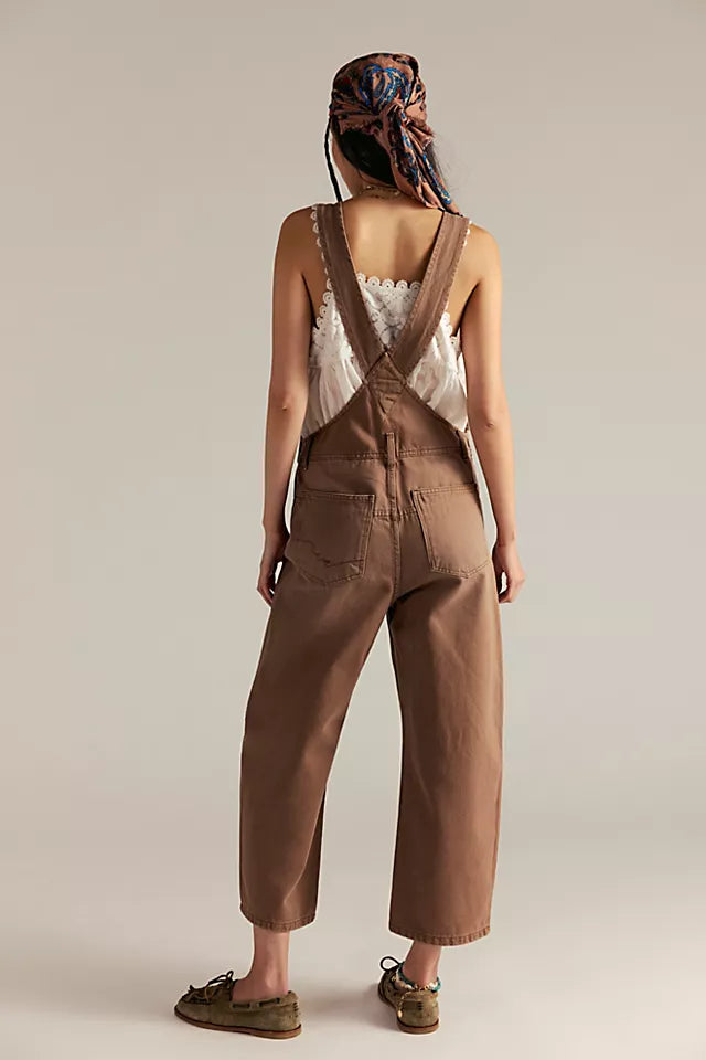 Free People Deep Trance Overalls in relaxed fit with wide-leg silhouette, boho-inspired design, and adjustable straps, Brown Sugar