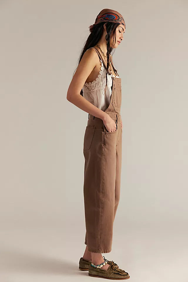 Free People Deep Trance Overalls in relaxed fit with wide-leg silhouette, boho-inspired design, and adjustable straps, Brown Sugar