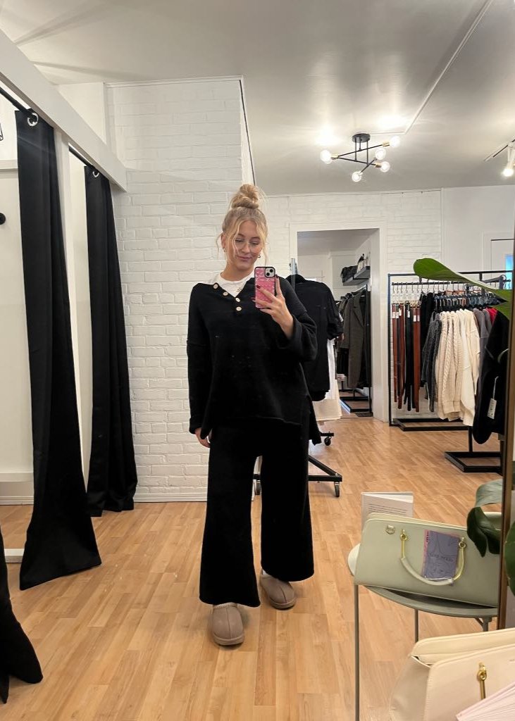 Free People Hailee Sweater Set featuring a soft, ribbed knit long-sleeve sweater and matching high-waisted, wide-leg pants. The relaxed fit of both pieces offers a comfortable and stylish look, perfect for lounging or casual outings, Black