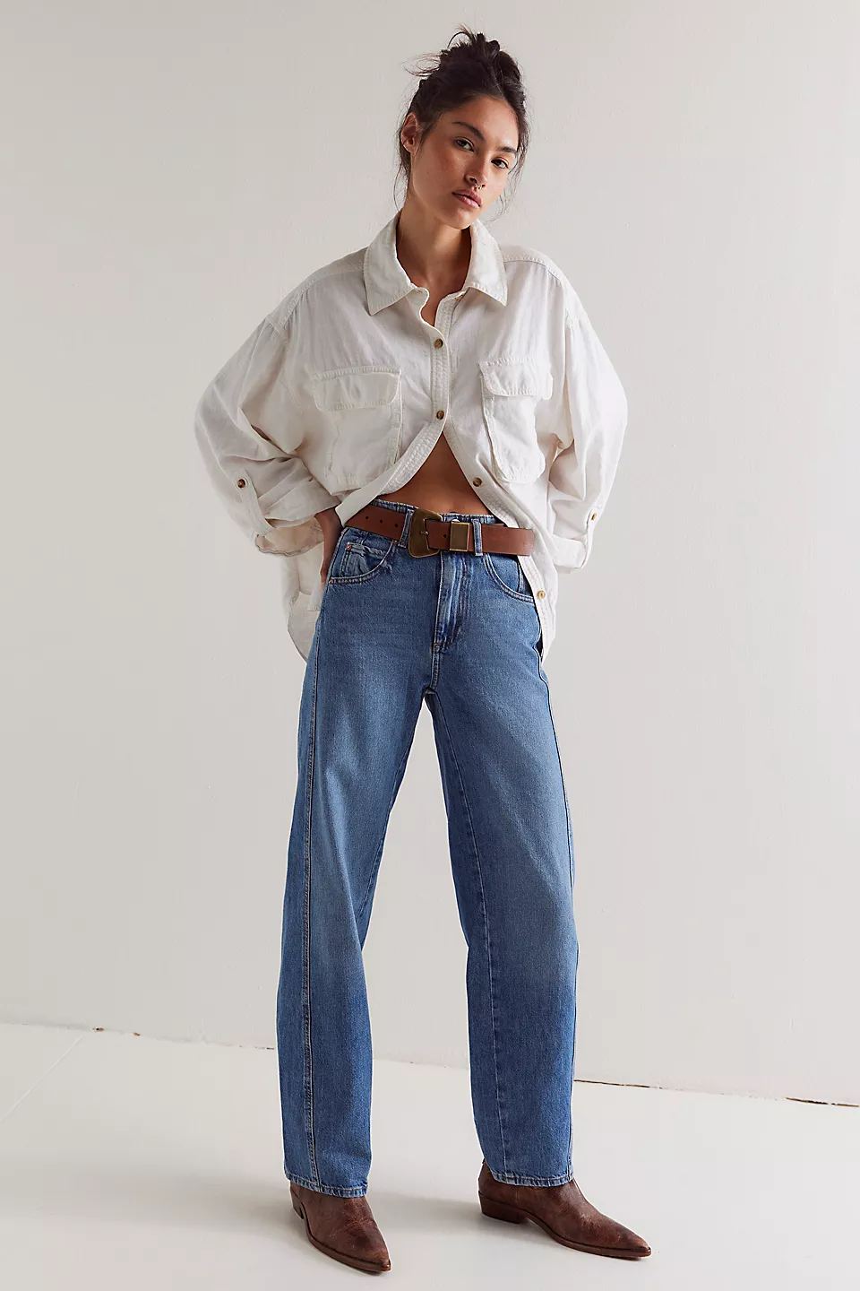 Free People Aster Straight Leg Jeans made from soft denim with a classic straight-leg fit. These jeans feature a mid-rise design, offering a comfortable and versatile look with a timeless, vintage-inspired feel, Swarm