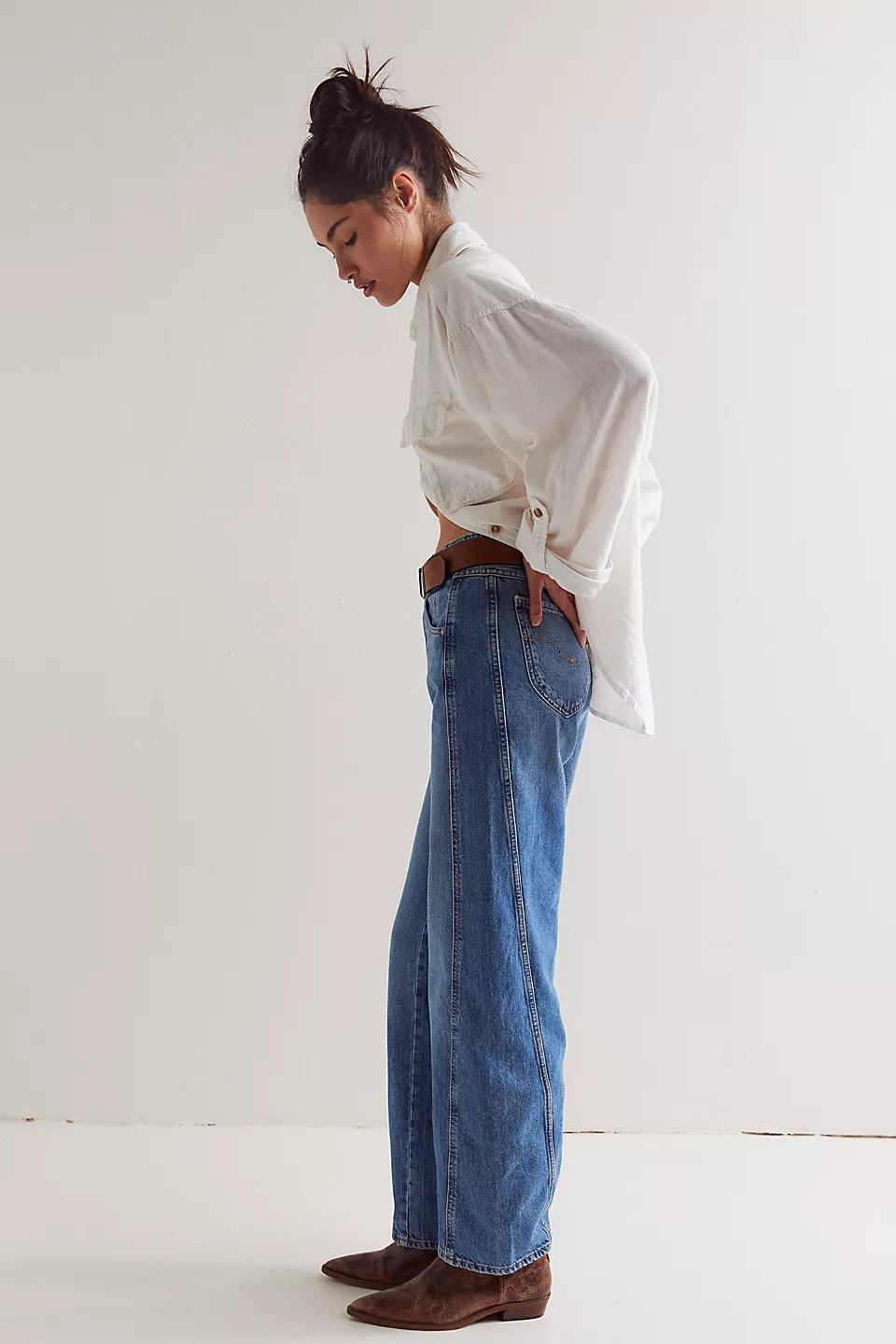 Free People Aster Straight Leg Jeans made from soft denim with a classic straight-leg fit. These jeans feature a mid-rise design, offering a comfortable and versatile look with a timeless, vintage-inspired feel, Swarm