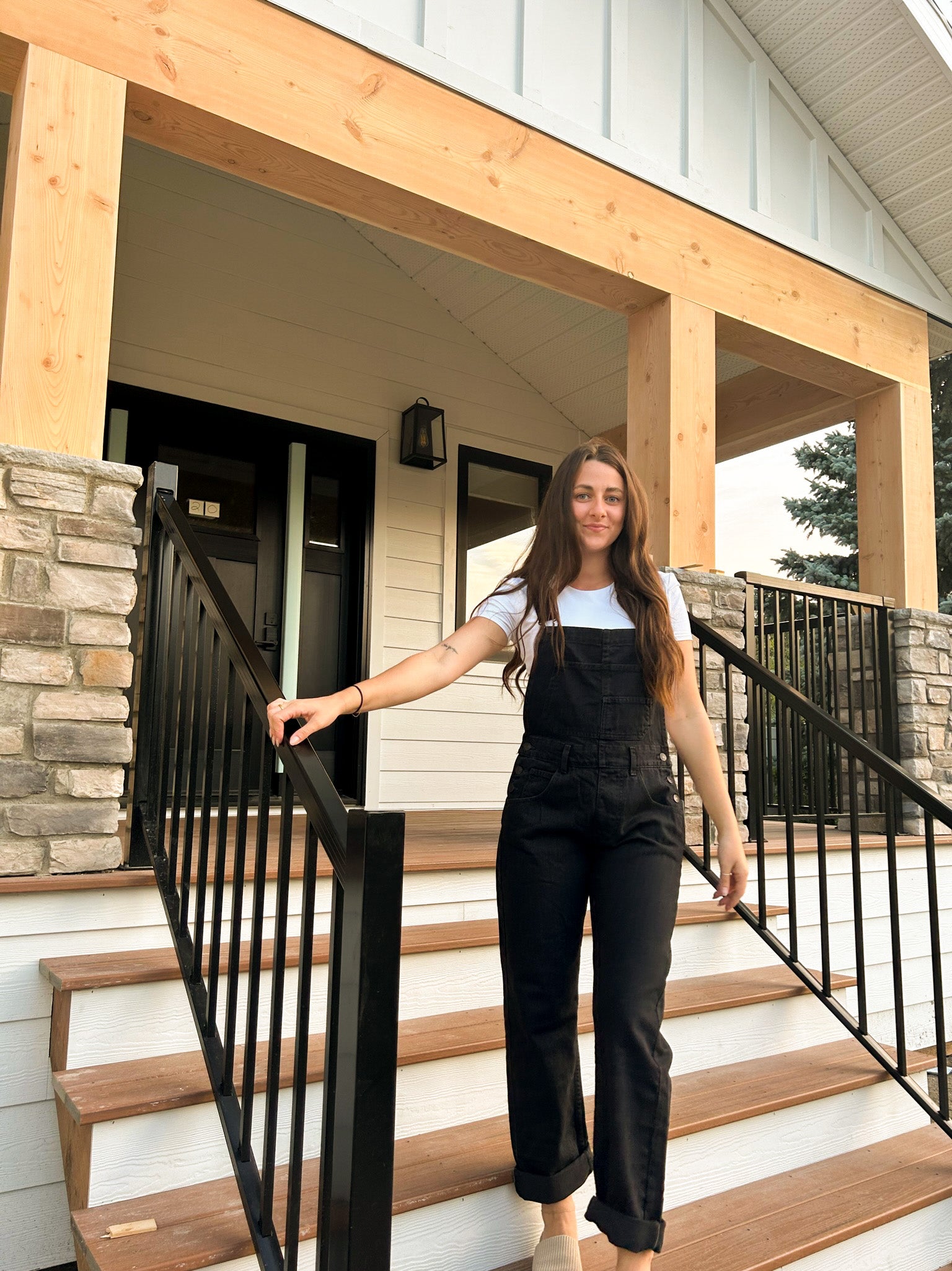 We The Free Ziggy Denim Overalls featuring a relaxed, vintage-inspired fit with wide legs and a distressed, worn-in look. The overalls have adjustable shoulder straps, a front bib pocket, and a button-up closure, offering both style and comfort for everyday wear, Mineral Black