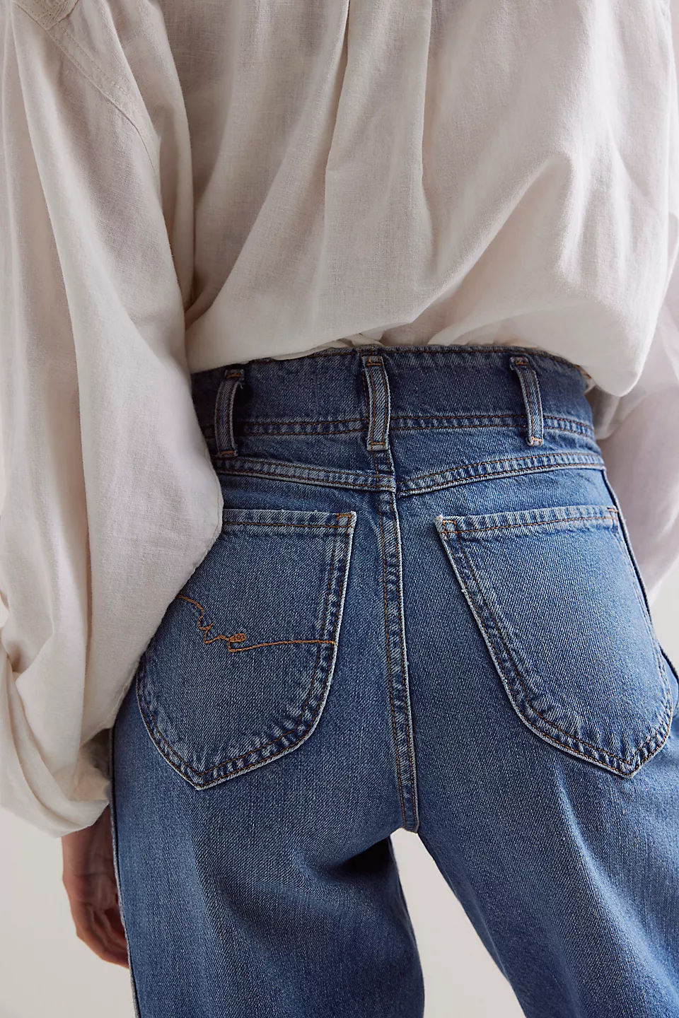 Free People Aster Straight Leg Jeans made from soft denim with a classic straight-leg fit. These jeans feature a mid-rise design, offering a comfortable and versatile look with a timeless, vintage-inspired feel, Swarm