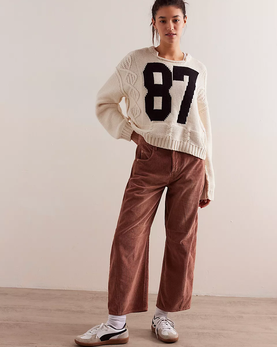 Free People Good Luck Cord Barrel Jeans made from soft corduroy fabric with a relaxed, loose fit and wide-leg silhouette. These jeans offer a comfortable, vintage-inspired look with a laid-back style, Emperador