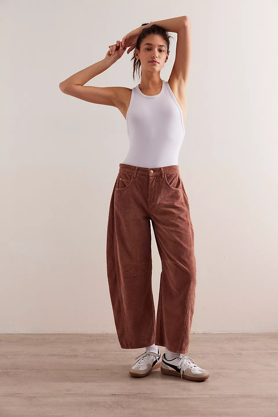 Free People Good Luck Cord Barrel Jeans made from soft corduroy fabric with a relaxed, loose fit and wide-leg silhouette. These jeans offer a comfortable, vintage-inspired look with a laid-back style, Emperador