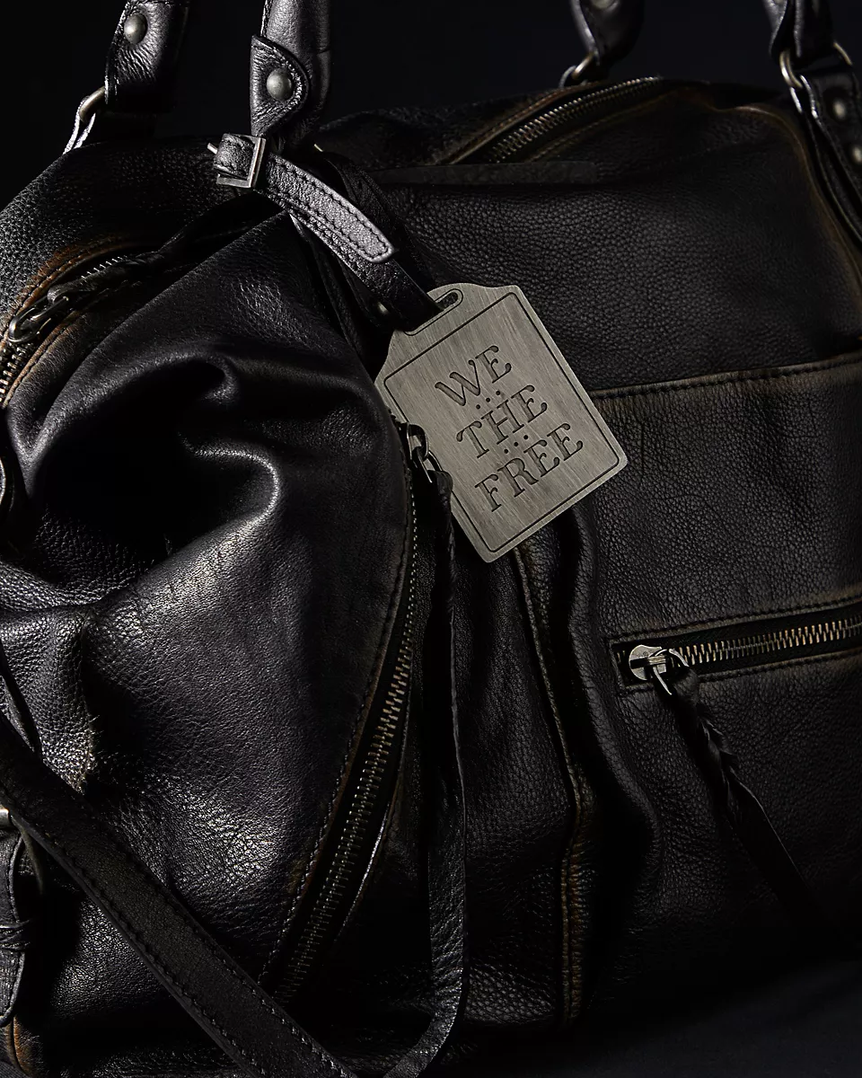 We the Free Emerson Tote Bag showcasing a spacious, simple design with sturdy handles, ideal for carrying essentials in style, Coal