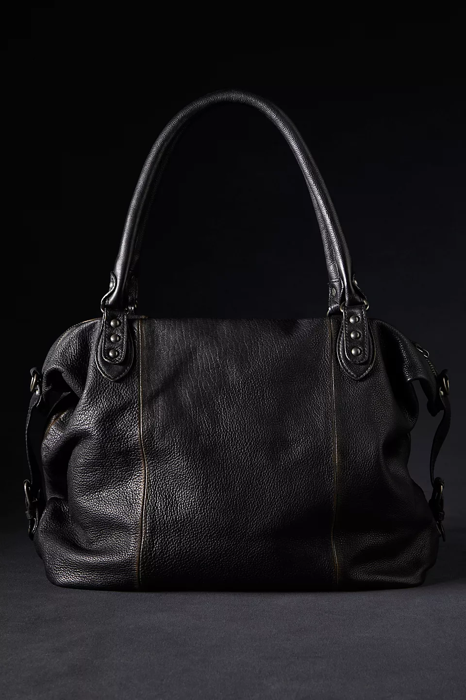 We the Free Emerson Tote Bag showcasing a spacious, simple design with sturdy handles, ideal for carrying essentials in style, Coal