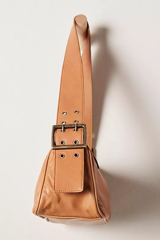 Free People Arm Candy Bag in luxe leather with a thick adjustable strap, rivet detailing, and a zip-top closure, Golden Coast