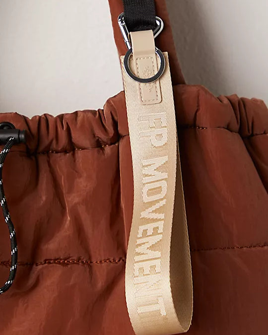 "Free People There It Is Keychain – A sporty and versatile keychain with the FP Movement logo at the center, Off White