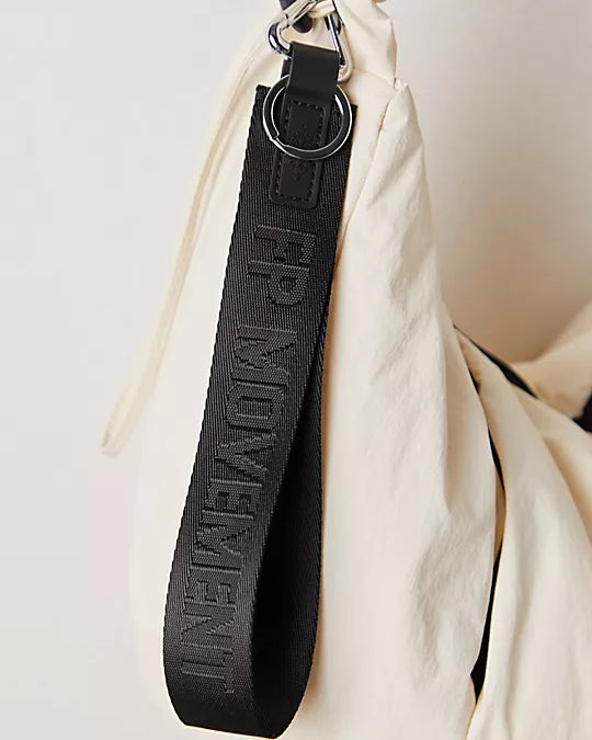 Free People There It Is Keychain – A sporty and versatile keychain with the FP Movement logo at the center, Black