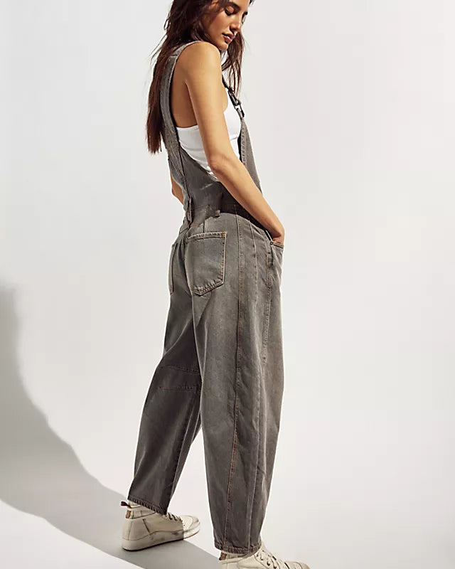 We The Free Good Luck Barrel Overalls with a relaxed, loose-fit design and wide-leg silhouette. These overalls feature adjustable straps and a soft, distressed denim fabric, offering a casual, boho-inspired look with a comfortable, laid-back feel, Archive Grey