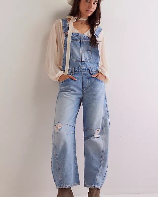 We The Free Good Luck Barrel Overalls with a relaxed, loose-fit design and wide-leg silhouette. These overalls feature adjustable straps and a soft, distressed denim fabric, offering a casual, boho-inspired look with a comfortable, laid-back feel, Going Steady