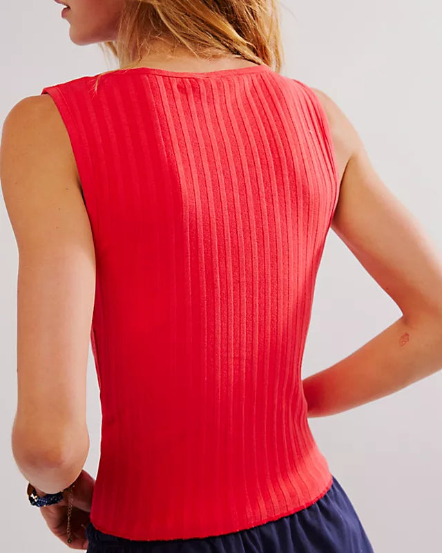 Free People Tilly Vest made from a soft, textured fabric with a relaxed, sleeveless design. This button-front vest offers a stylish and lightweight layering piece, perfect for adding a chic touch to any outfit, Tomato Puree