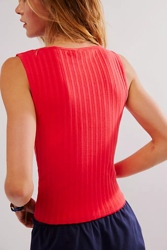 Free People Tilly Vest made from a soft, textured fabric with a relaxed, sleeveless design. This button-front vest offers a stylish and lightweight layering piece, perfect for adding a chic touch to any outfit, Tomato Puree