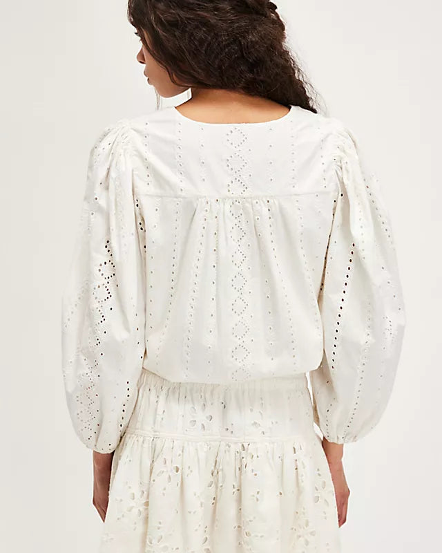 Free People Roselle Eyelet Mini Skirt – A feminine mini skirt featuring delicate eyelet detailing, a high waist, and a flattering, A-line silhouette for a light and breezy look, Ivory