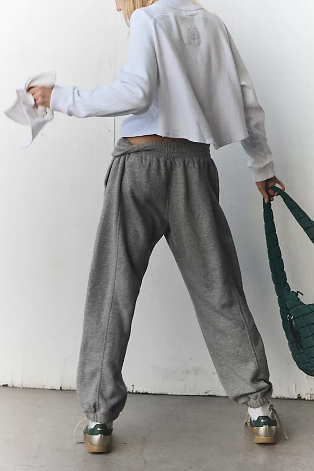 Free People Sprint to the Finish Pant featuring a mid-rise waist, relaxed fit through the hips and thighs, and a tapered leg for a modern, casual look, Heather Grey