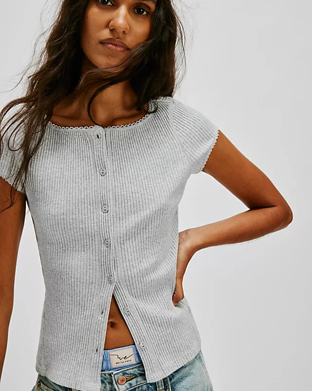 Free People Most Wanted Cardi with a form-fitting ribbed fabric, short capped sleeves, and buttons down the front, Light Heather