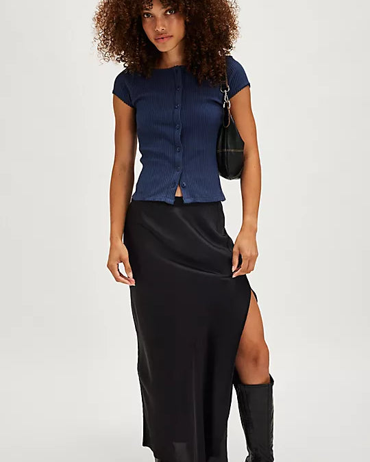 Free People Most Wanted Cardi with a form-fitting ribbed fabric, short capped sleeves, and buttons down the front, Navy