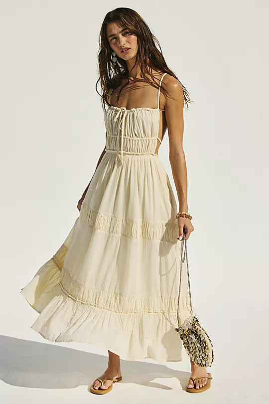 Free People Taking Sides Maxi Dress – a billowy, tiered maxi dress with a smocked bodice, front tie detail, open back, and adjustable tie-back straps, Wet Plaster