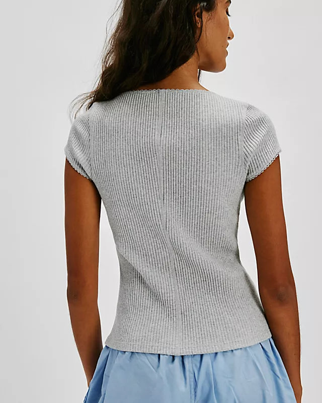 Free People Most Wanted Cardi with a form-fitting ribbed fabric, short capped sleeves, and buttons down the front, Light Heather