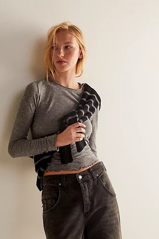 Free People Be My Baby Long Sleeve – A soft, fitted long sleeve top with a scoop neckline and smooth fabric, offering a comfortable and casual style, Heather Grey
