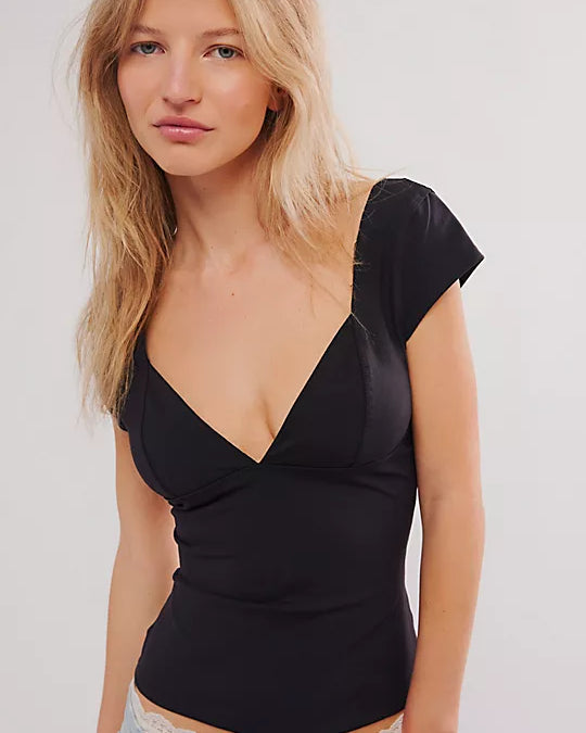 Free People Duo Corset Cami with a sweetheart neckline, capped sleeves, seamed cup design, and sculpting Duo fabric featuring a compressive mesh underlayer, Black