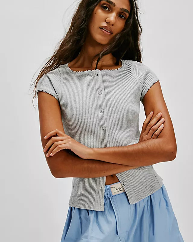 Free People Most Wanted Cardi with a form-fitting ribbed fabric, short capped sleeves, and buttons down the front, Light Heather