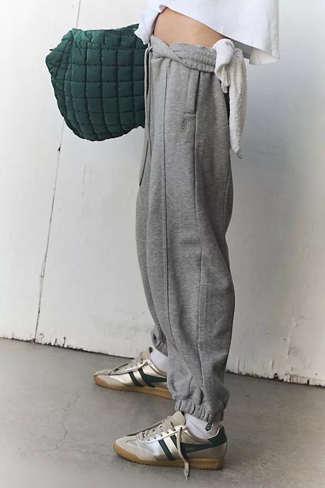 Free People Sprint to the Finish Pant featuring a mid-rise waist, relaxed fit through the hips and thighs, and a tapered leg for a modern, casual look, Heather Grey