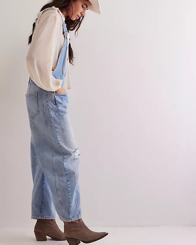 We The Free Good Luck Barrel Overalls with a relaxed, loose-fit design and wide-leg silhouette. These overalls feature adjustable straps and a soft, distressed denim fabric, offering a casual, boho-inspired look with a comfortable, laid-back feel, Going Steady
