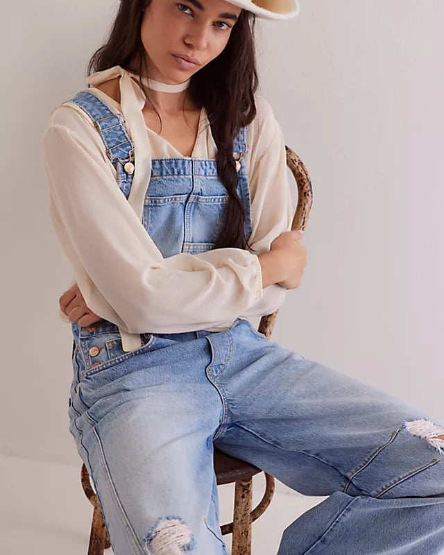 We The Free Good Luck Barrel Overalls with a relaxed, loose-fit design and wide-leg silhouette. These overalls feature adjustable straps and a soft, distressed denim fabric, offering a casual, boho-inspired look with a comfortable, laid-back feel, Going Steady