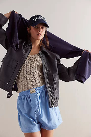 Free People Blaire Vegan Leather Jacket made from smooth, high-quality faux leather with a sleek, fitted design. This jacket features a zip-up front, classic collar, and minimalistic details, offering an edgy, versatile look that pairs perfectly with both casual and dressy outfits, Charcoal Combo