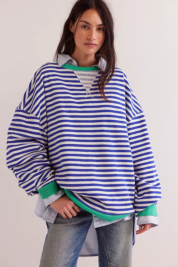 Free People classic striped crew sweater featuring horizontal stripes. The classic crewneck design offers a relaxed and comfortable fit, perfect for a laid-back, stylish look, Sand dollar combo.