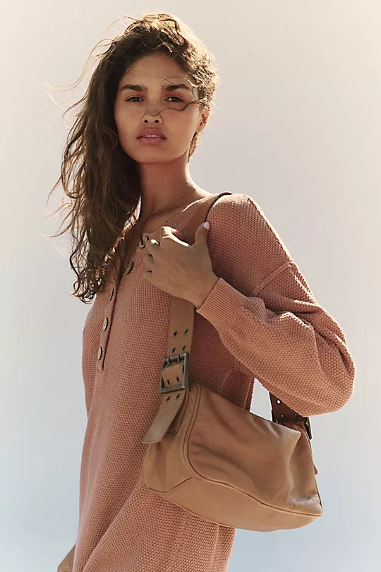 Free People Arm Candy Bag in luxe leather with a thick adjustable strap, rivet detailing, and a zip-top closure, Golden Coast
