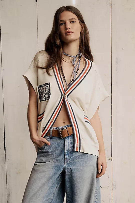 We The Free Double Cross Belt made from distressed leather with a bold, double-cross buckle design. This adjustable belt adds a rustic, boho-inspired touch to any outfit, perfect for pairing with jeans or dresses, Cognac
