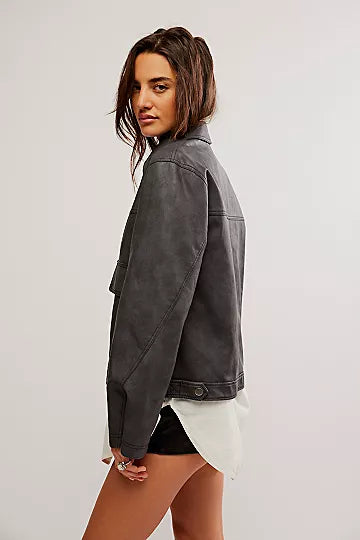 Free People Blaire Vegan Leather Jacket made from smooth, high-quality faux leather with a sleek, fitted design. This jacket features a zip-up front, classic collar, and minimalistic details, offering an edgy, versatile look that pairs perfectly with both casual and dressy outfits, Charcoal Combo