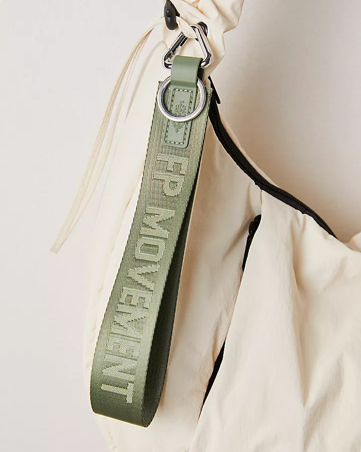 "Free People There It Is Keychain – A sporty and versatile keychain with the FP Movement logo at the center, Washed Sage