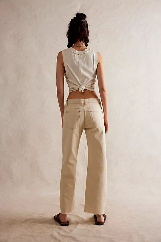 We The Free Risk Taker Mid-Rise Jeans made from soft denim with a relaxed fit and straight-leg silhouette. These jeans feature a mid-rise design, offering a casual, comfortable fit with a vintage-inspired look, Ecru
