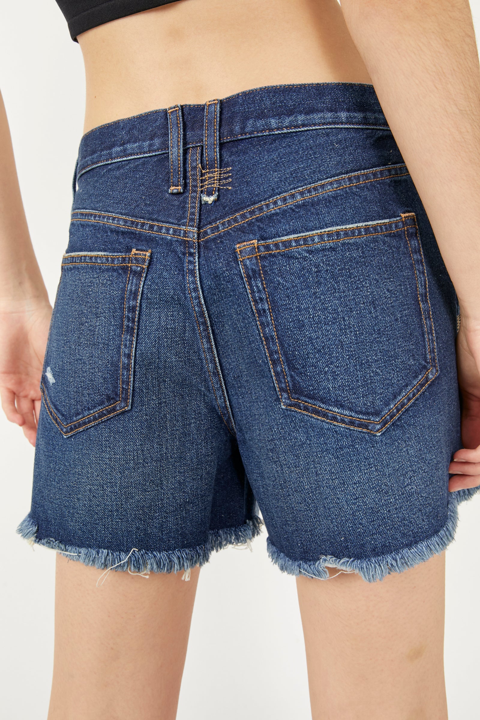 Free People Makai Cutoff Shorts – High-waisted denim shorts with a frayed hem, offering a relaxed fit and a vintage-inspired style for a casual, laid-back look Deep Sea