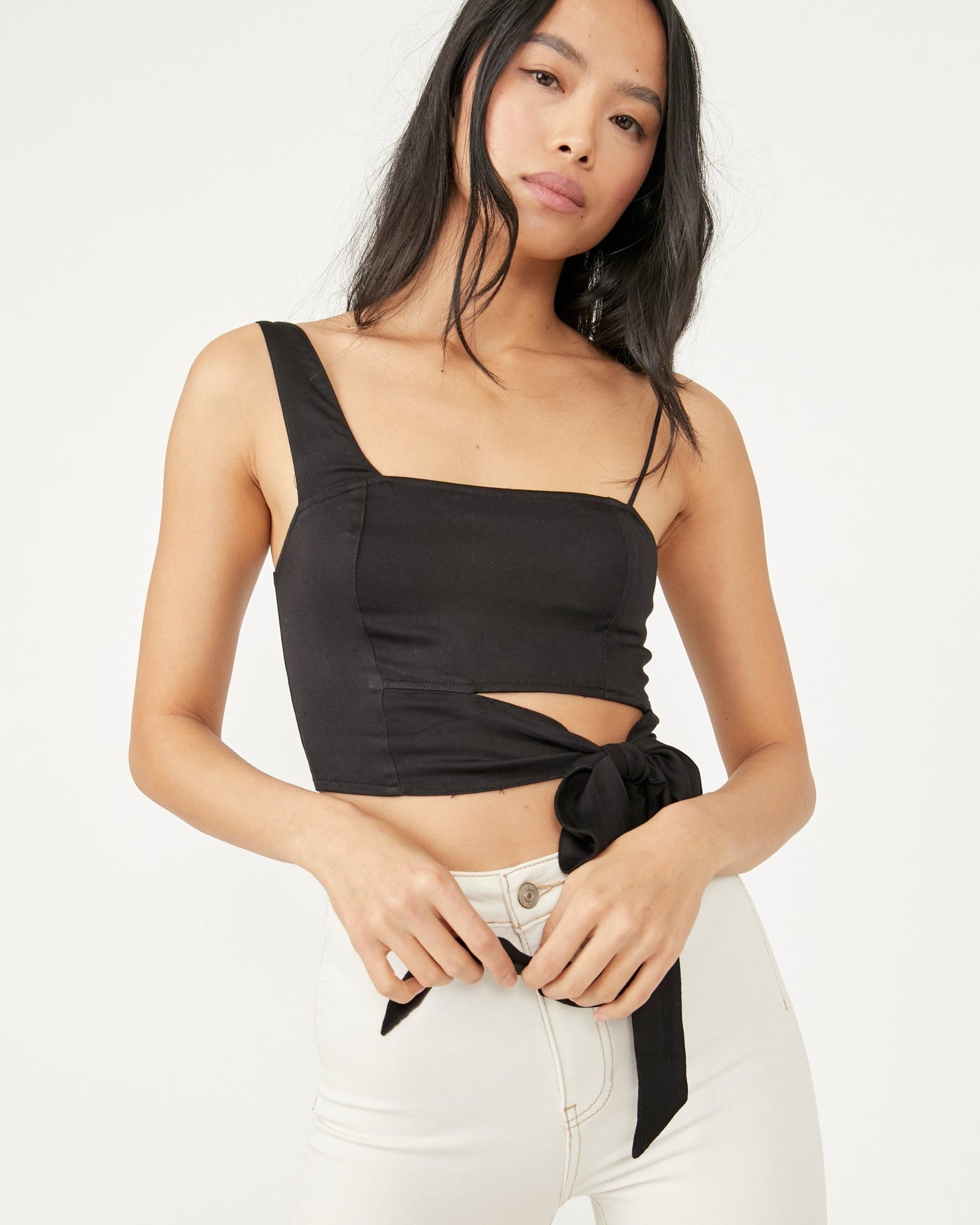 Free People Mila Top – A fitted top with adjustable shoulder straps, smocking at the back, darting at the front, and a cutout at the bottom front, Black
