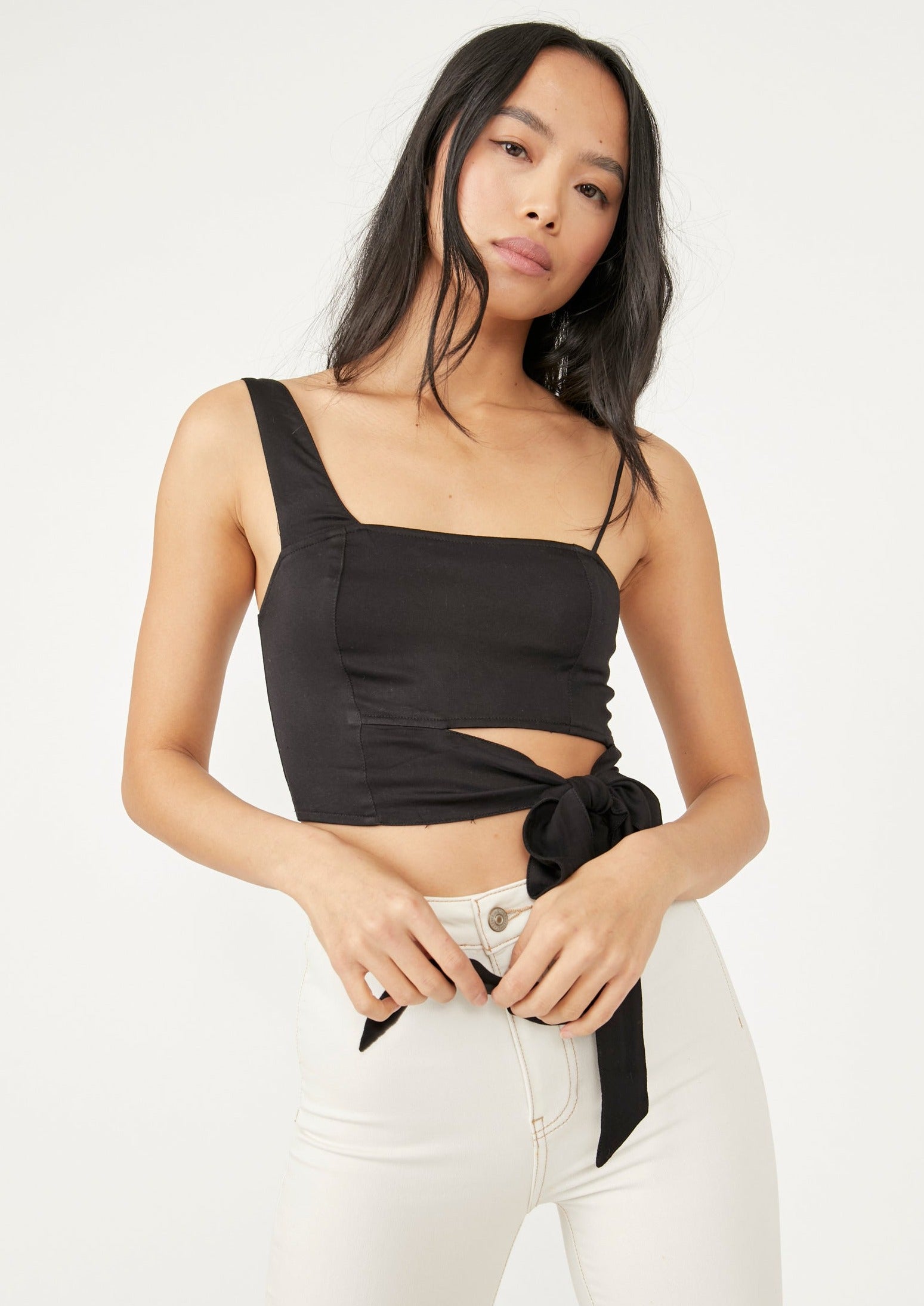Free People Mila Top – A fitted top with adjustable shoulder straps, smocking at the back, darting at the front, and a cutout at the bottom front, Black