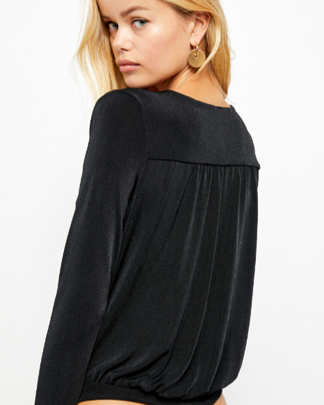 Free People Turnt Bodysuit – A form-fitting bodysuit with a high neckline, sleeveless design, and smooth fabric, Black