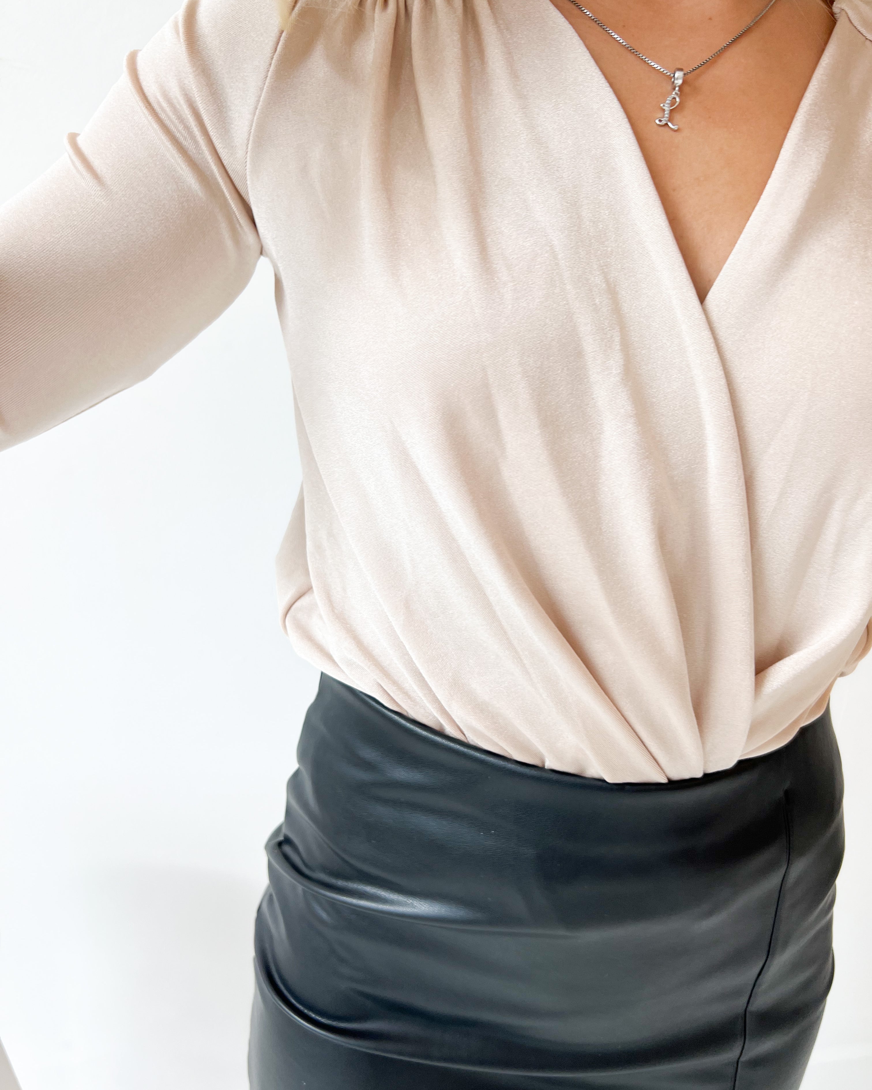 Free People Turnt Bodysuit – A form-fitting bodysuit with a high neckline, sleeveless design, and smooth fabric, Ocean Pearl