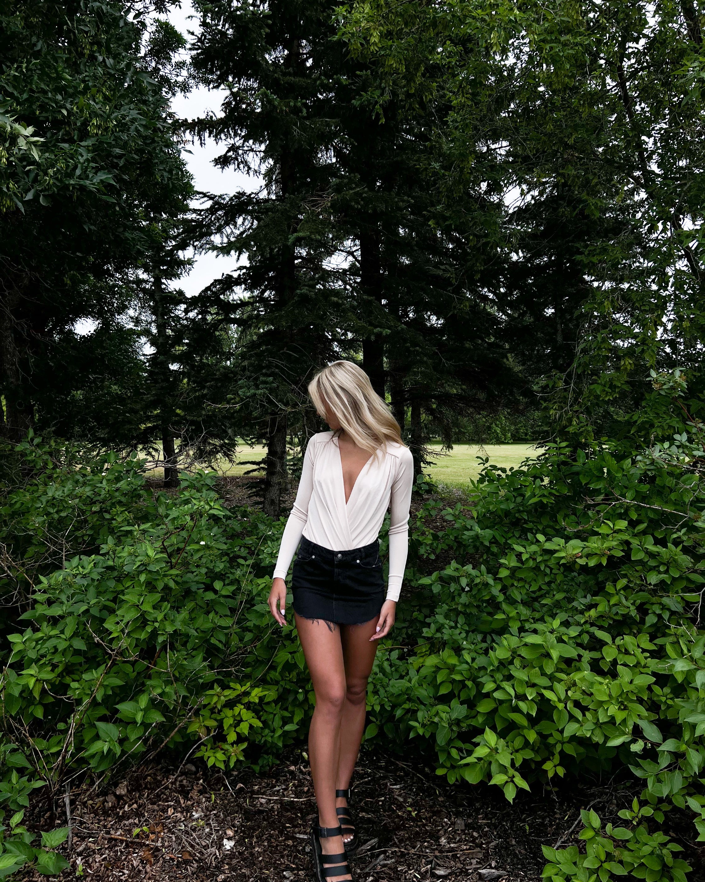 Free People Turnt Bodysuit – A form-fitting bodysuit with a high neckline, sleeveless design, and smooth fabric, Ocean Pearl